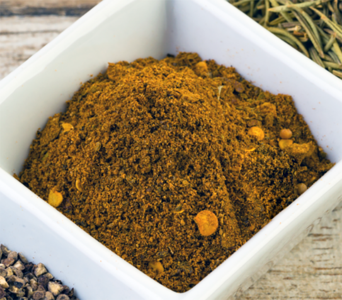 Cameroon spice powder blend in a small white dish