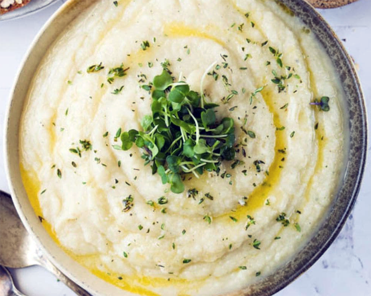 celeriac and tarragon puree garnished with cress in a bowl