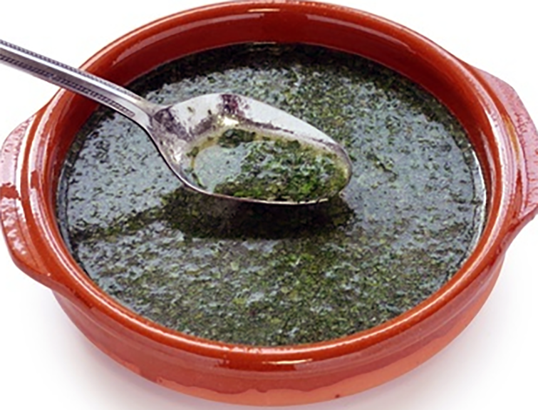 Mouloukhiyé, Chadian jute mallow leaf stew in an earthenware bowl