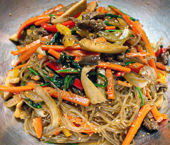 stir-fried Korean japchae in a wok
