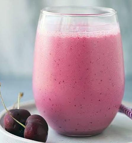 cherry, cranberry juice and cherry yoghurt smoothie in a glass