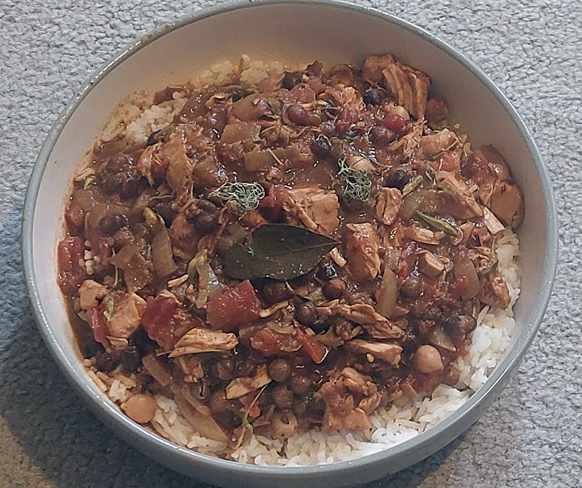 chicken breast and mixed vegetables cooked in a kitchen foil parcel