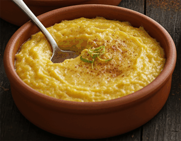 coconut and egg custard in an earthenware spoon