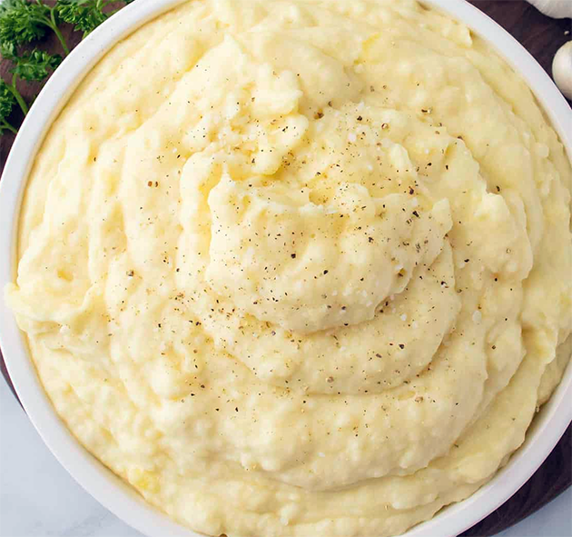 super creamy mashed potato piled in a bowl