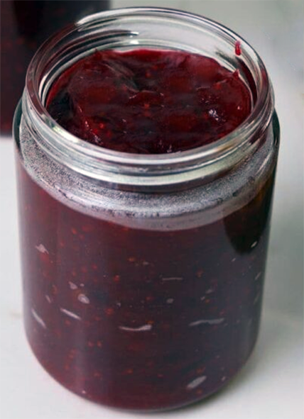 crowberry and orange jelly in a jam jar
