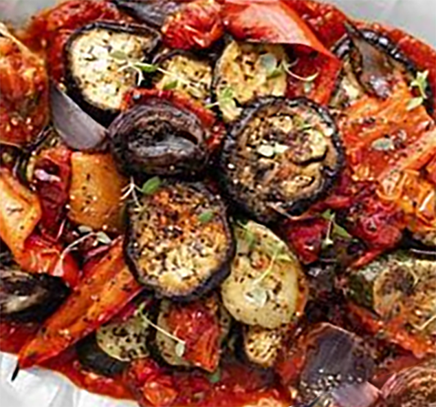 mixed cypriot oven-baked vegetables in a tomato, herb, anchovy and olive base