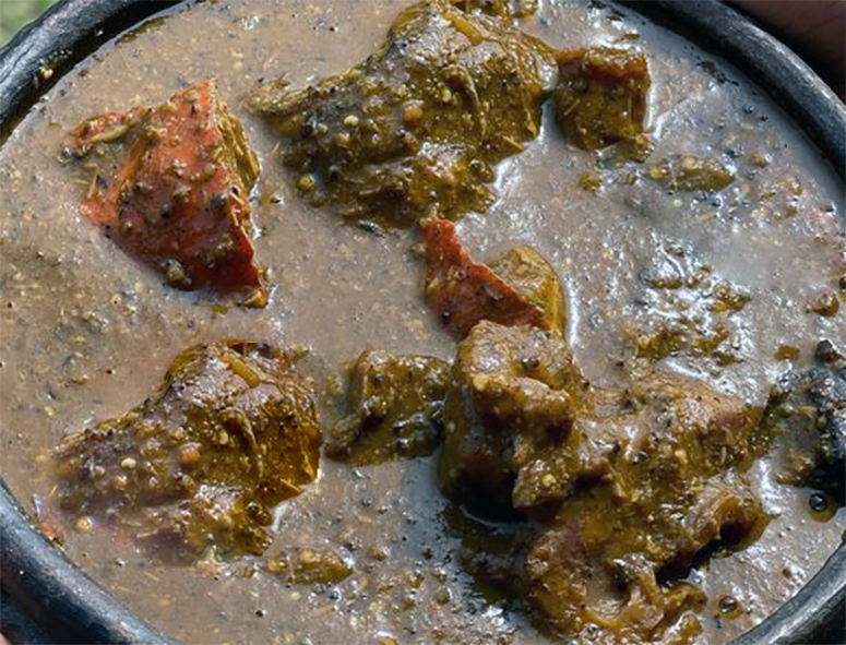 stew of grasscutter in an okra powder, red oil and mushroom base