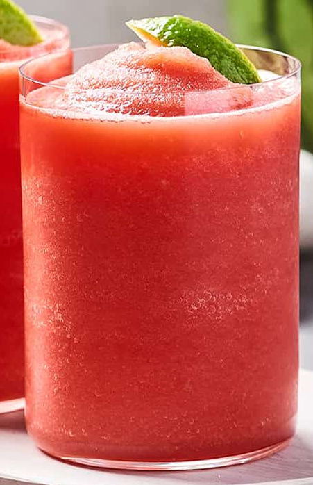 double melon smoothie garnished with a piece of watermelon