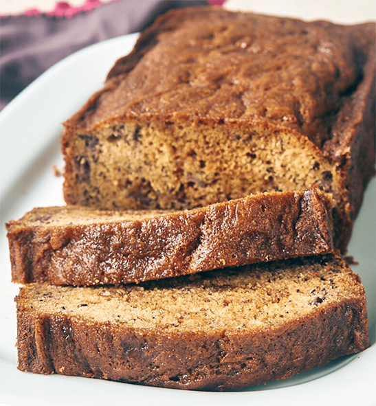 dulce de leche banana bread sliced on a serving dish
