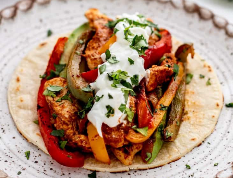 Chicken fajita arranged on a plate</a>