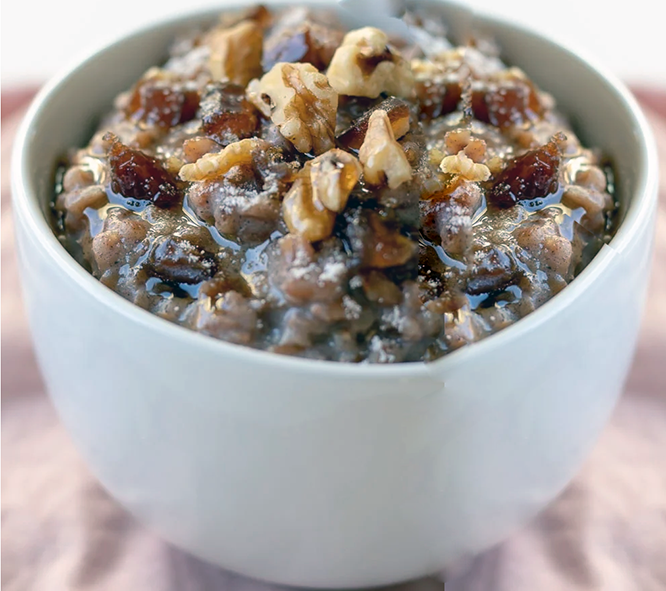 farro breakfast porridge with dates in a bowl