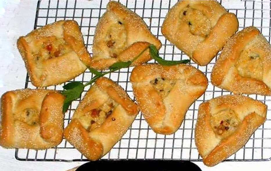 cypriot easter cheese-filled pastries cooling on a wire rack