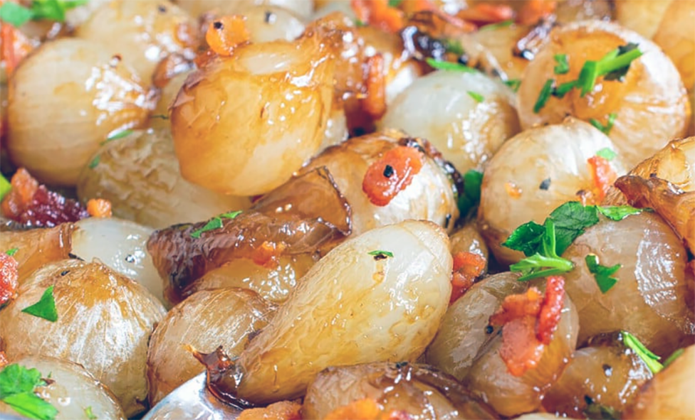 glazed pearl onions garnished with bacon and chives