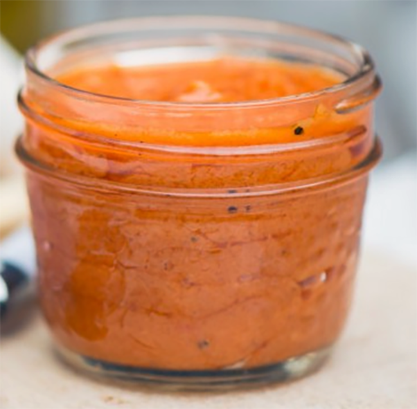 fresh tomato coulis in a glass jar