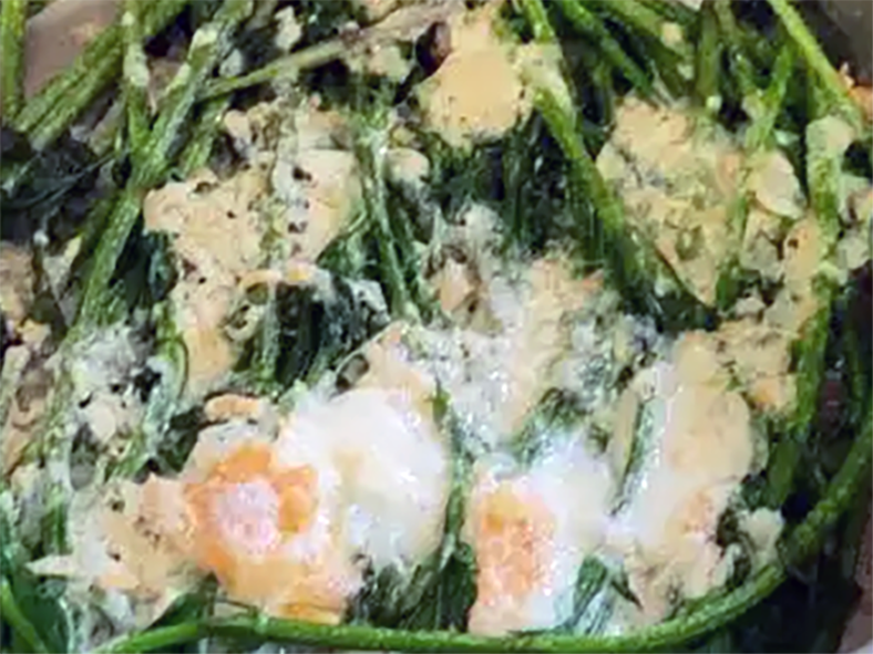 hop shoots that are pan fried with garlic and served topped with raclette cheese melted under the grill