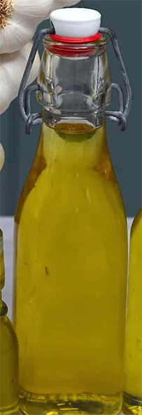 oil infused with pureed garlic in a stoppered bottle