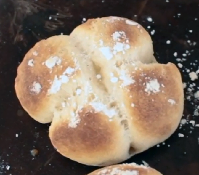 baked wig, divided into four quarters on a baking tray