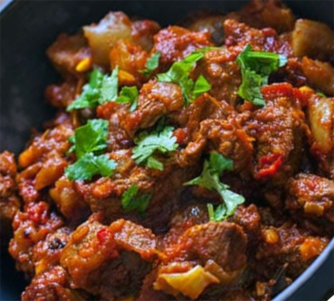 goat meat tagine served in a balti dish