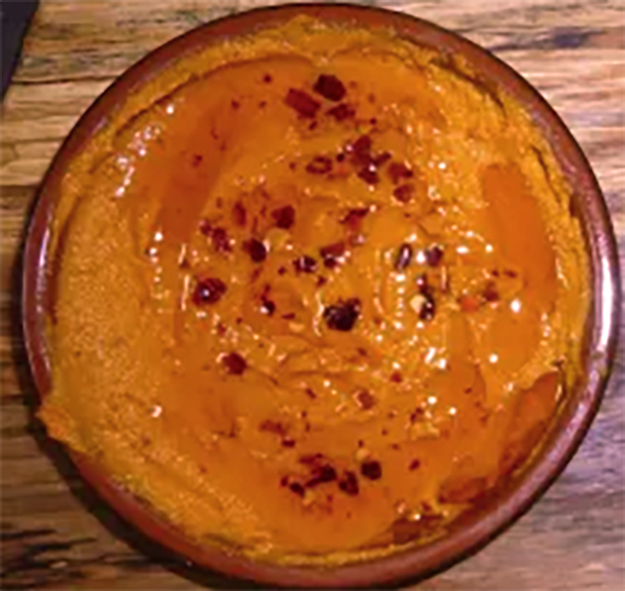 plum, sweet potato and hot sauce dip in a bowl