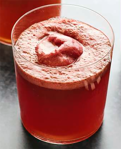 Halloween sparkle punch served in a glass topped with a scoop of blackberry sherbet
