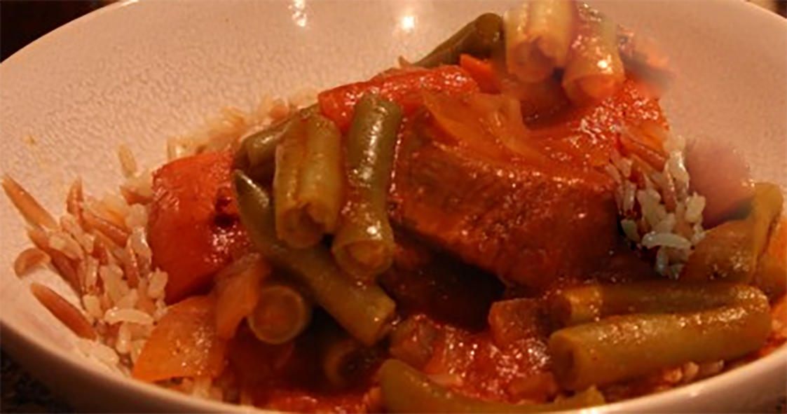 beef, green bean and orzo pasta stew in a white bowl