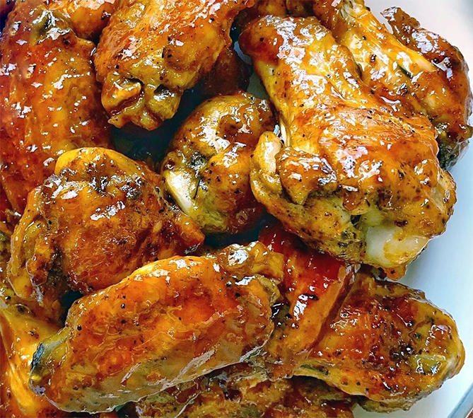 honeyed chicken wings served on a plate