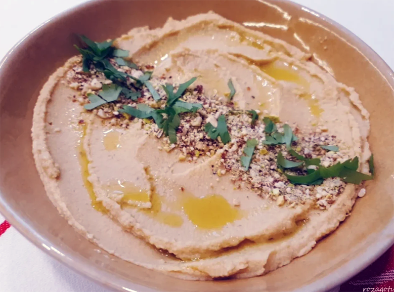 chickpea hummus flavoured with dukkah spice served topped with dukkah
