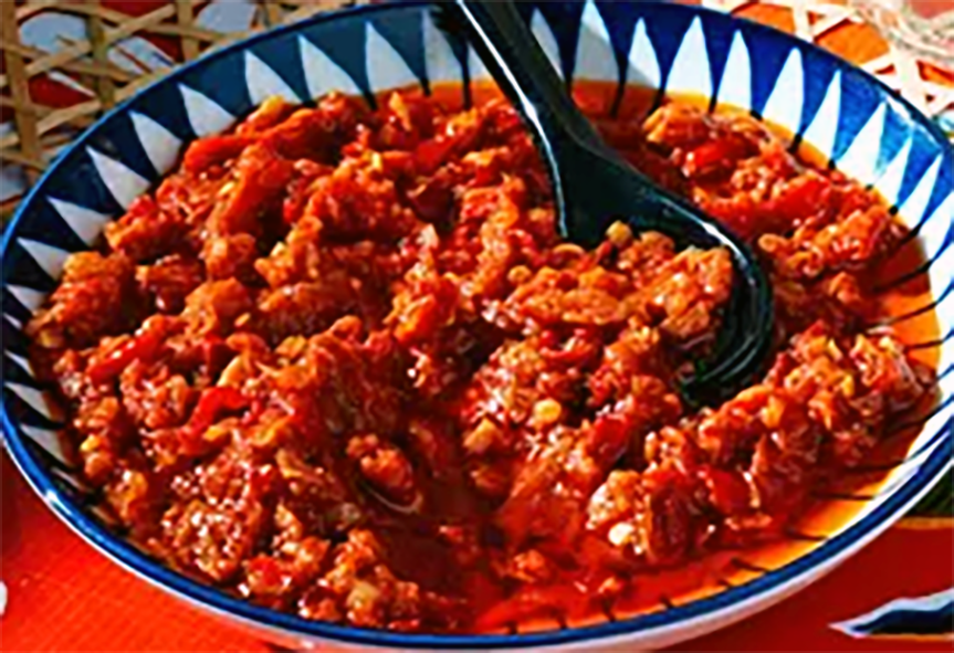 Javanese sambal bajak in a bowl with a spoon