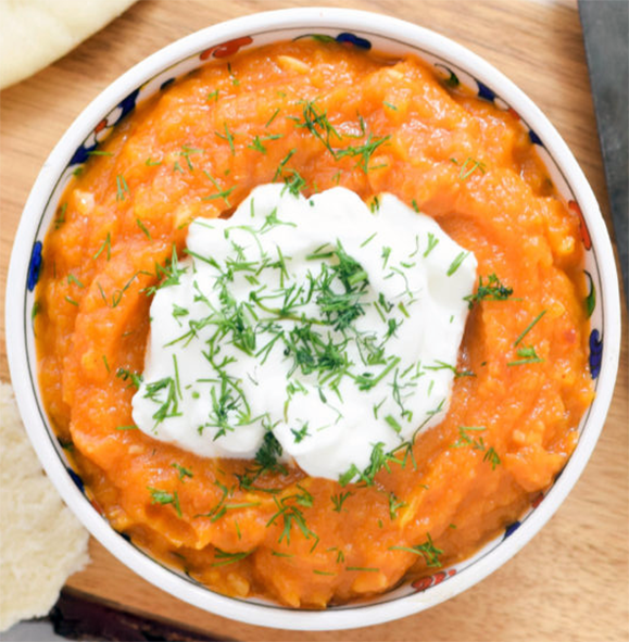 pumpkin dip kara'a served topped with sour cream