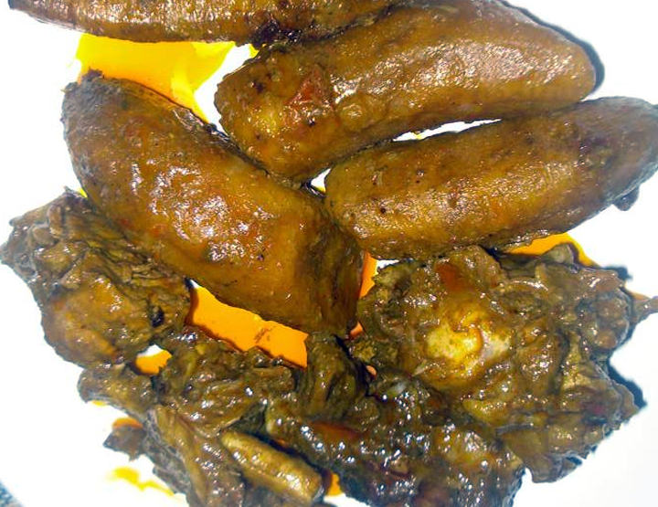 stew of meat and plantains on a white plate