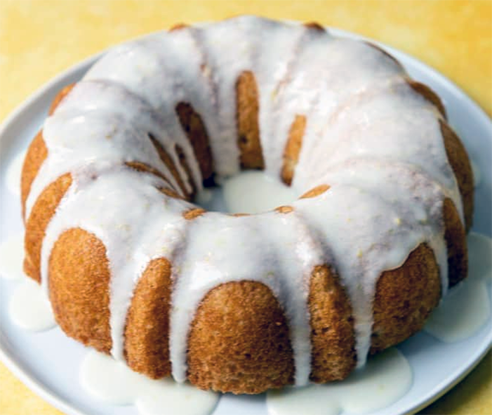 lemon glazed bundt cake topped with lemon slices