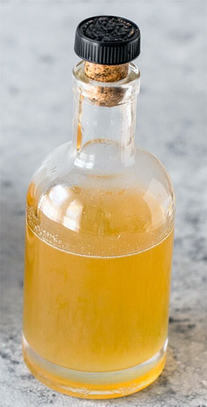 Cypriot lemon syrup in a bottle with a cork stopper