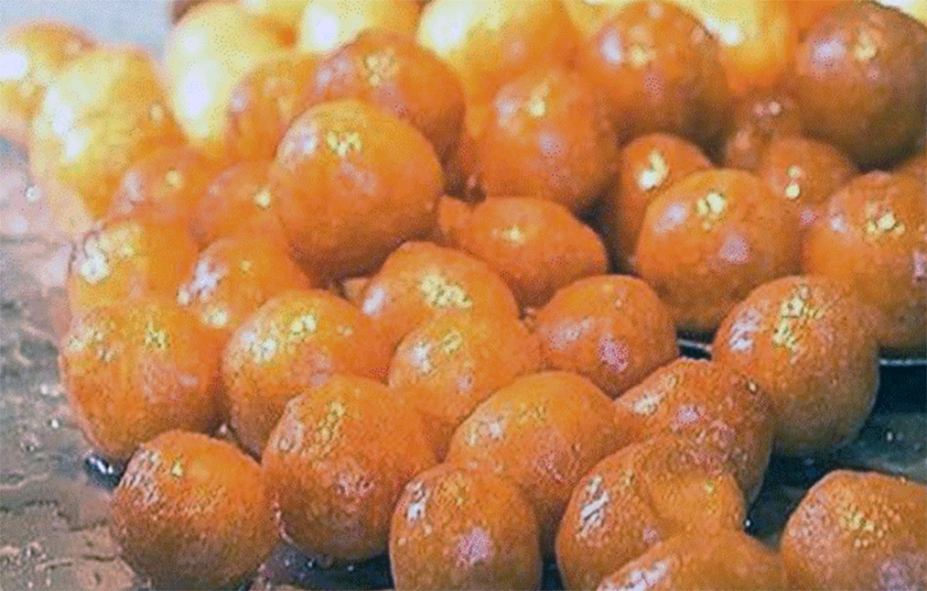 cypriot lokmades, deep fried round doughnuts turned in honey syrup