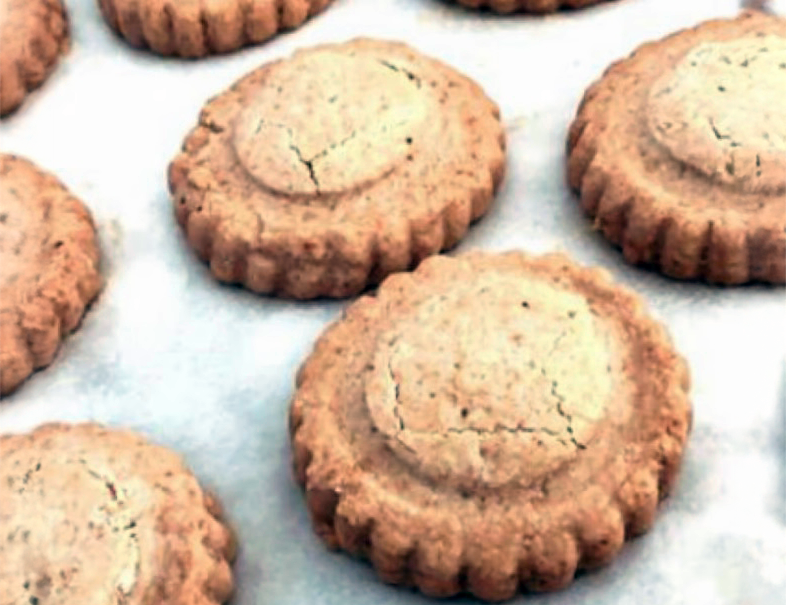 date-filled biscuits on baking paper