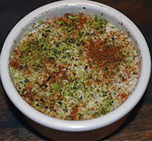 mackerel seaweed pate served in a ramekin and garnished with sea salt, quatre algues and smoked paprika