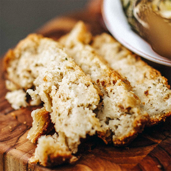 baked almond suet pudding sliced on a chopping block