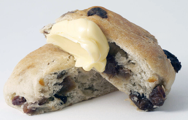 yeasted banbury cake halved and with a pat of butter