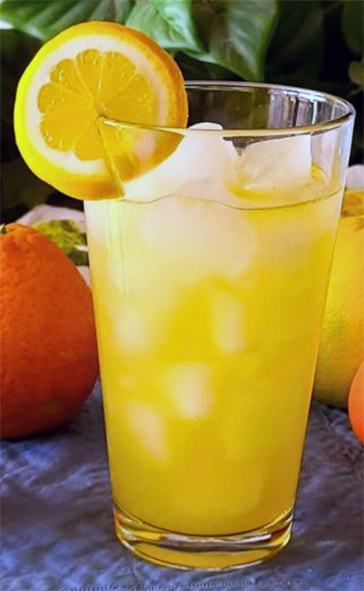 tangerine squash served diluted in a tall glass over ice