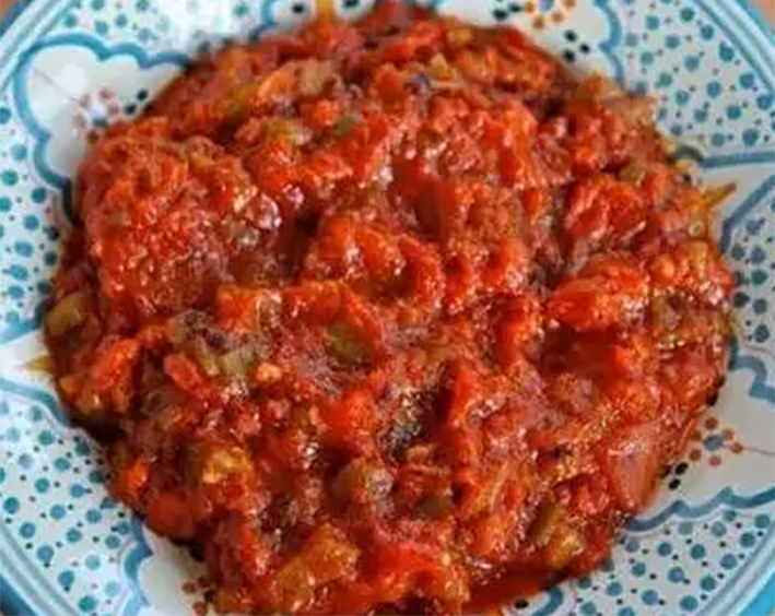 Matbucha cooked spicy salad on a plate