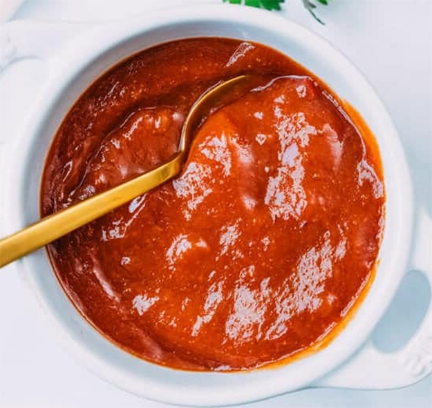 mexican red sauce in a white dish