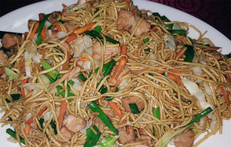 Mauritian stir-fried mines frites noodle dish on a plate