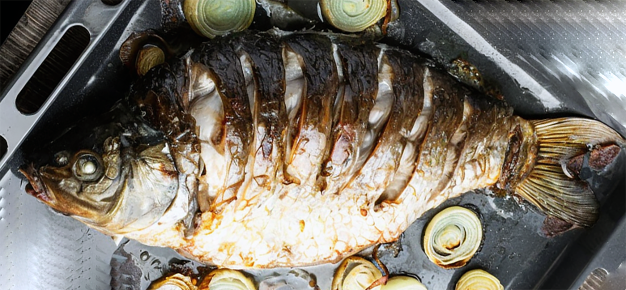 baked carp on a roasting tin