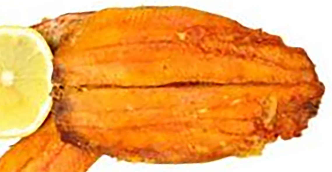 boiled kipper with a slice of lemon