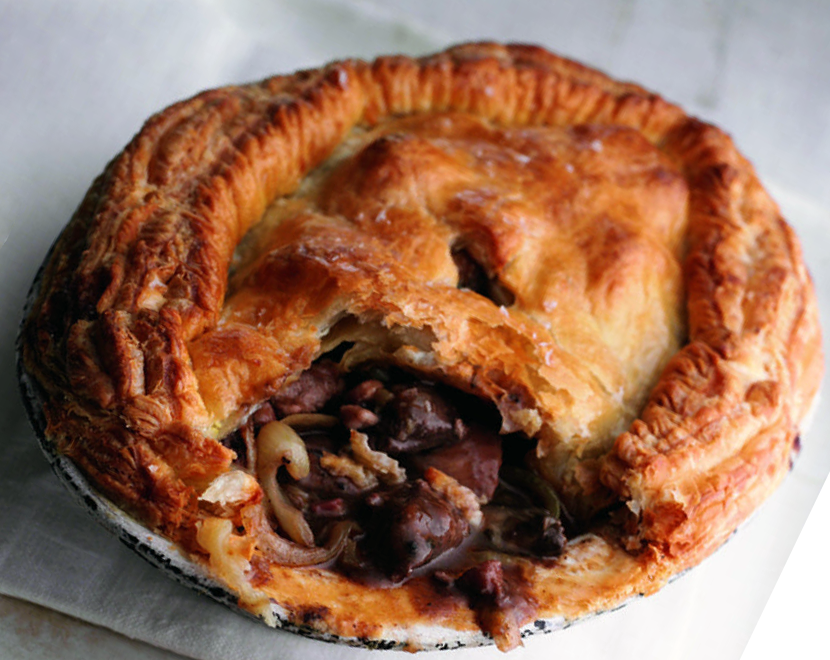 grouse pie with a section of crust removed to reveal the filling