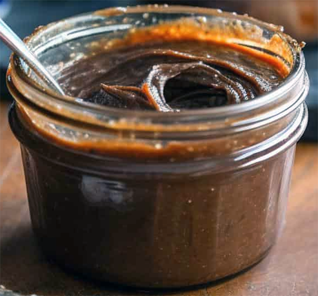 potted anchovy and butter paste in a glass jar