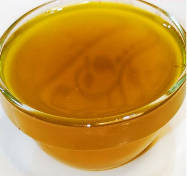 filtered mustard oil in a glass dish