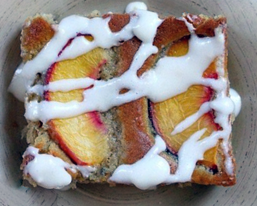 rectangle of nectarine snacking cake on a plate