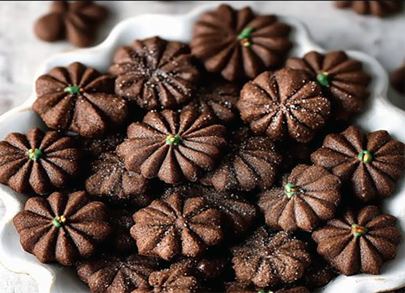 Dutch chocolate and cinnamon sprits biscuits arranged on a  plate