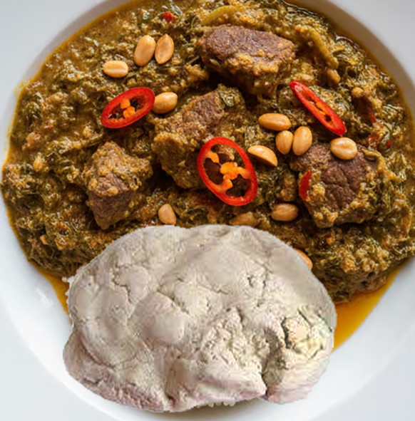 beef and cassava leaf stew served on a plate with a ball of cassava dough