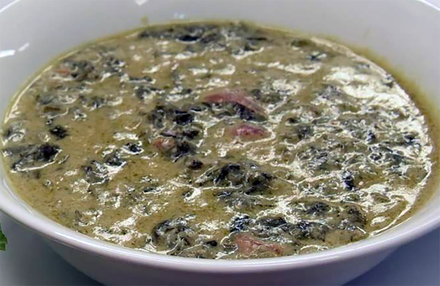cowpea leaves in a coconut milk and tomato base served in a bowl